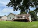 Spacious backyard with a wooden deck, ideal for outdoor entertaining and relaxation at 2511 Old Pond Dr, Lincolnton, NC 28092