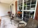 Cozy front porch setup with outdoor furniture, perfect for relaxing and enjoying the outdoors at 2511 Old Pond Dr, Lincolnton, NC 28092