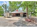 Large garage with vintage Texaco sign, multiple tools, and ample parking space at 3311 Camden Rd, Marshville, NC 28103