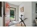 Inviting foyer with hardwood floors, glass table, and a bright, open feel at 402 Walnut St, China Grove, NC 28023