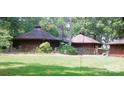 An exterior shot of a home with a unique roof style and chimney at 404 Long Shoals Rd, Bessemer City, NC 28016