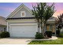 Charming home with gray siding, manicured lawn, and a two-car garage at sunset at 4079 Murray St, Fort Mill, SC 29707