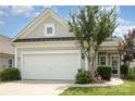 Home boasts gray siding, a well-maintained lawn, and a two-car garage at 4079 Murray St, Fort Mill, SC 29707