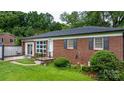 Charming brick home featuring a well-manicured front lawn and decorative shutters at 5083 Fleetwood Dr, Hickory, NC 28602