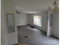 A neutral living room with a large window and light-colored walls at 5324 Weblee Ct, Kings Mountain, NC 28086