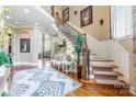 Grand foyer with hardwood floors, ornate staircase, and elegant decor at 572 W Shiloh Unity Rd, Lancaster, SC 29720
