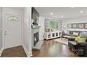 Inviting living room with hardwood floors, fireplace, and stylish decor for comfortable living at 5914 Mt Holly Huntersville Rd, Charlotte, NC 28216