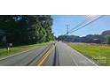 A sunny day view of street at 619 N Main St, Landis, NC 28088