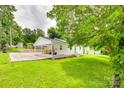 Exterior side view showcasing a well-maintained lawn and white siding of the charming home at 814 Grace St, Kings Mountain, NC 28086