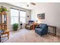 Cozy living room with natural light, plush seating, and a ceiling fan, creating a relaxing atmosphere at 8516 Profit Ln, Charlotte, NC 28215