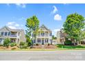 Inviting two-story home with double porches and well-maintained landscaping at 10509 Serape Rd, Charlotte, NC 28277