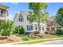 A charming two-story home with blue shutters surrounded by green landscaping at 10509 Serape Rd, Charlotte, NC 28277