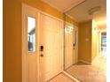 Bright foyer with tile flooring and a mirror reflecting the natural light flowing through the entryway at 1590 Springpoint Rd # B, Rock Hill, SC 29732