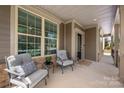 Inviting front porch with comfortable seating, perfect for relaxing and enjoying the neighborhood views at 1805 Trading Path Ln, Waxhaw, NC 28173
