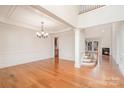 Bright, open-concept living space boasts elegant trim, hardwood floors, and a cozy fireplace at 2100 Goddard Way, Waxhaw, NC 28173