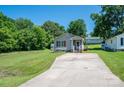 Traditional-style home with well-kept lawn and driveway leading to the inviting front porch at 219 E Boston Ave # 141516, Bessemer City, NC 28016