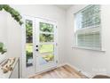 Bright entryway with a front door and a lovely view of the front yard at 2818 Old Steele Creek Rd, Charlotte, NC 28208