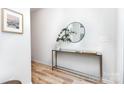 Bright hallway featuring modern decor, a mirror, and stylish console table at 2818 Old Steele Creek Rd, Charlotte, NC 28208