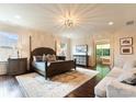 Spacious main bedroom with wood floors, a seating area and a luxurious ensuite bathroom at 4023 Alexandra Alley Dr, Charlotte, NC 28210