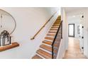 Elegant staircase featuring wood treads, iron railing, and modern design details at 412 State St, Charlotte, NC 28208