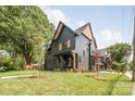 Charming two-story home with manicured lawn and modern architectural details at 4900 Doris Ave, Charlotte, NC 28205