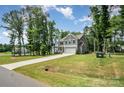 Traditional two-story home with lush front lawn, long driveway and attached two car garage at 5499 Angus Dr, Stanfield, NC 28163