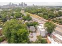 Panoramic aerial view of the neighborhood with the city skyline in the background on a sunny day at 558 Oakland Ave, Charlotte, NC 28204