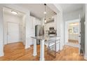 Bright, stylish kitchen featuring a marble countertop island and stainless steel appliances at 558 Oakland Ave, Charlotte, NC 28204
