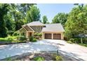 Exterior of home showcasing a long driveway and a two-car garage at 841 16Th Avenue Nw Ln, Hickory, NC 28601