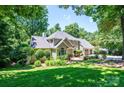Exterior of charming home with lush green landscaping and a spacious lawn at 841 16Th Avenue Nw Ln, Hickory, NC 28601