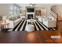 Bright living room with hardwood floors, fireplace, built-in shelves, and large windows at 1332 Kings Grove Dr # Lot 18, York, SC 29745