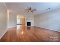 Spacious living room with hardwood floors and a corner fireplace at 1735 Robinwood Rd, Gastonia, NC 28054