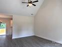 Bright living room features high ceilings, neutral walls, and sliding glass door to the outdoor deck at 2051 Highwood Rd, Rock Hill, SC 29732