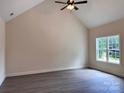Bright living room boasts high ceilings, neutral walls, and a large window for ample natural light at 2051 Highwood Rd, Rock Hill, SC 29732