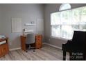 Cozy home office with light gray walls and a large window for natural light at 3092 S Legacy Park Blvd, Fort Mill, SC 29707