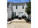 Back patio with outdoor seating, a fire pit, and access to a small garden area at 4103 Christine Ln # E, Waxhaw, NC 28173