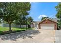 Spacious driveway leading to a charming home, complete with a basketball hoop for recreation at 4507 Mackinac St, Charlotte, NC 28269
