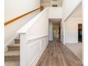 Inviting entryway with beautiful staircase, hardwood floors, and stylish wainscoting at 5233 Halverson Ct, Kannapolis, NC 28083