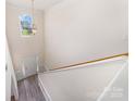 Open and bright foyer with view of the front door, hardwood floors, and natural light at 5233 Halverson Ct, Kannapolis, NC 28083