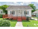 Inviting front exterior with walkway, freshly painted porch, and manicured lawn, ready to welcome you home at 1113 W 4Th Ave, Gastonia, NC 28052