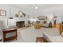Bright living room with fireplace, plush seating, and elegant decor throughout the living space at 1119 Holleybank Dr, Matthews, NC 28105