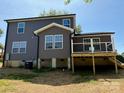 The backyard of this two-story home has a deck and stairs leading down to the yard at 112 Gilliatt St # 1, Shelby, NC 28150