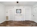 Bright living room features hardwood floors, white trim, and a decorative fireplace at 1224 Hollywood Ter, Albemarle, NC 28001