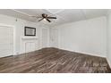 Bright living room features hardwood floors, white trim, and a decorative fireplace at 1224 Hollywood Ter, Albemarle, NC 28001
