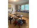 Functional kitchen with ample counter space, essential appliances and natural lighting, perfect for culinary projects at 124 Powder Sw St, Concord, NC 28025