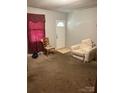 Inviting living room features a cozy seating area and a front door view at 124 Powder Sw St, Concord, NC 28025