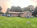 Well-maintained backyard with a brick house and lush green lawn at 169 Smith Clemmer Rd, Mount Holly, NC 28120