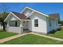 Well-maintained home featuring a cozy front porch and a neatly landscaped yard at 1704 16Th Ne St, Hickory, NC 28601
