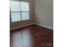 Bright bedroom with hardwood floors and a large window offering lots of natural light at 2150 Winthrop Chase Dr, Charlotte, NC 28212