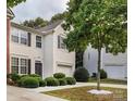Attractive two-story house featuring an attached garage and manicured landscaping at 2150 Winthrop Chase Dr, Charlotte, NC 28212
